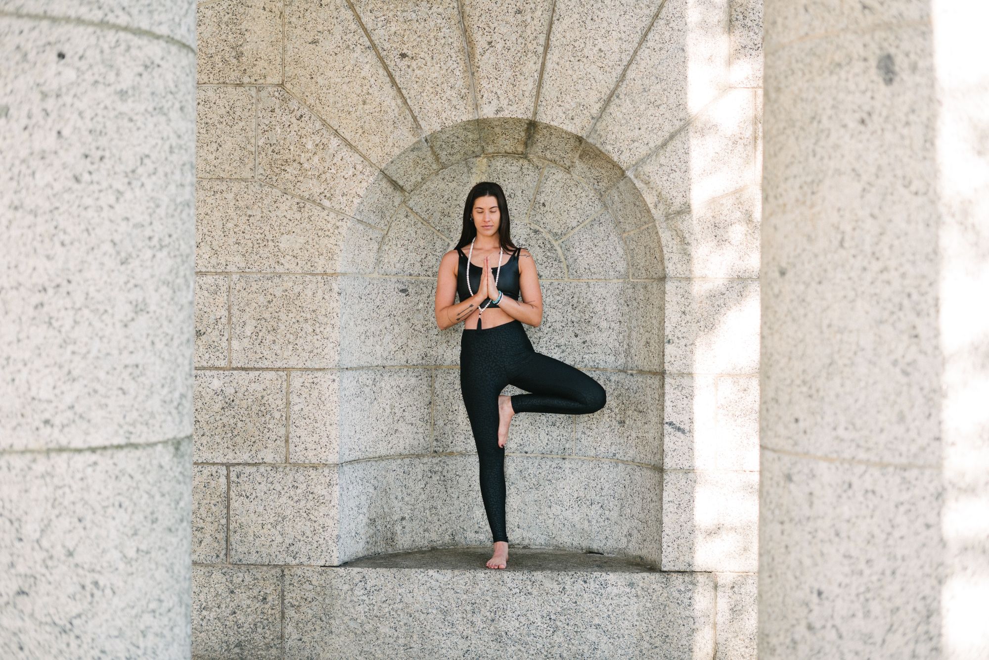Woman balancing on one leg in yoga position