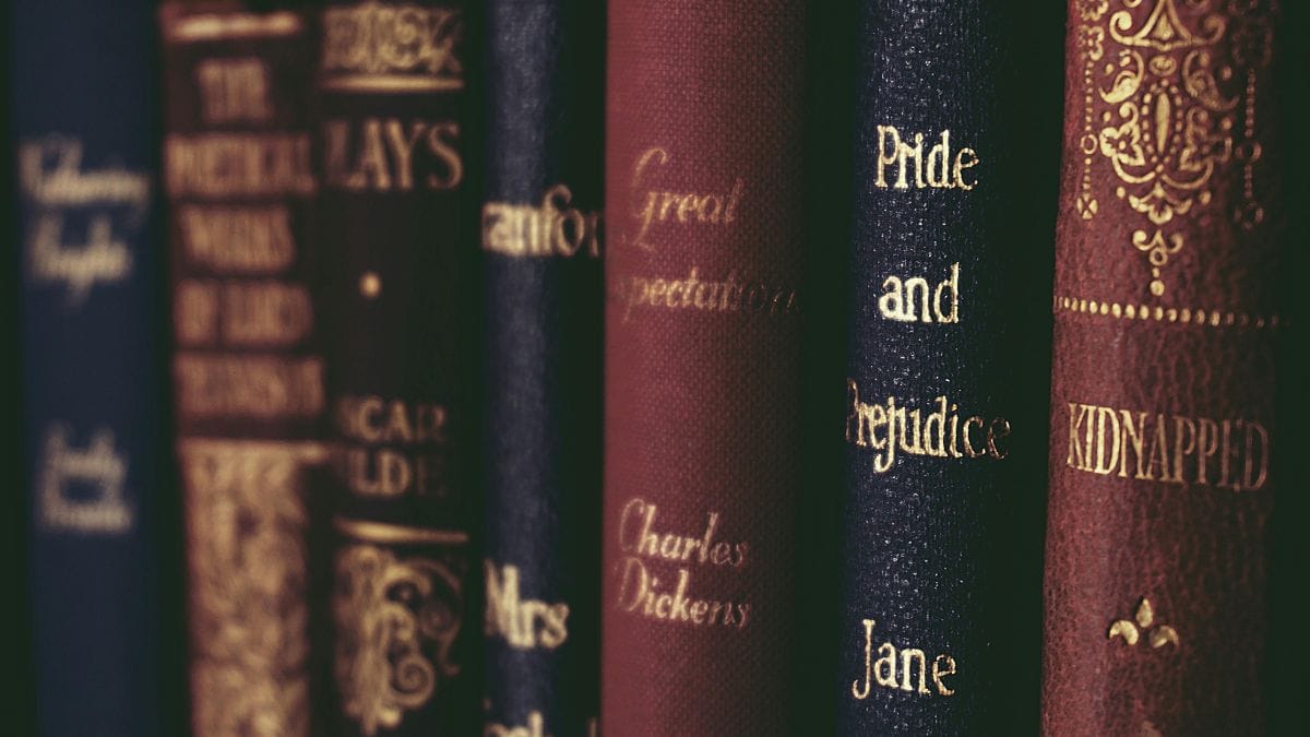 Charles Dickens' book sits on the shelf alongside other classics