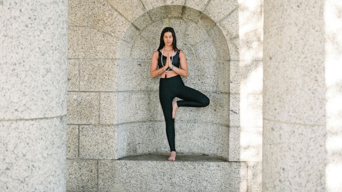 Woman balancing on one leg in yoga position